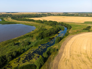 Fototapeta na wymiar Natural landscape of central Russia with field, river in August
