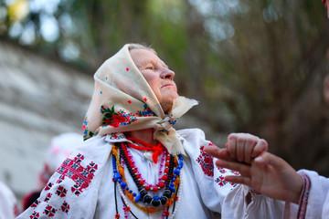 Belarus, Gomel, May 20, 2017.Belarus, Gomel, May 20, 2017. Holiday in the branch of the Vetkovsky Museum.An old woman dancing a dance in national clothes.Ethnic Slavic Dances.Grandmother dancing