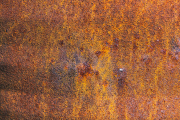 Rust on metallic surface. Rusted iron texture. Rusty metal background with copy space. Rough oxide plate close up. Strong rust. Hard decay of metal in macro. Oxidation of steel. Chemical reaction.