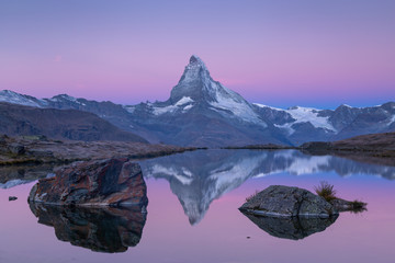 The famous Matterhorn reflected in the Stellisee during dawn. Zermatt, Switzerland.