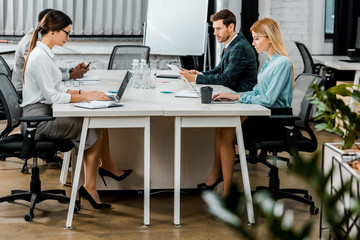 group of multicultural business colleagues working in office