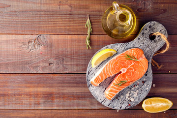 Salmon fillet slices with lime, salt, pepper, fennel and rosemary, ready to cook. - Image Top view