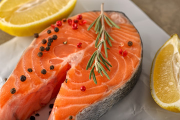 Salmon fillet slices with lime, salt, pepper, fennel and rosemary, ready to cook. - Image