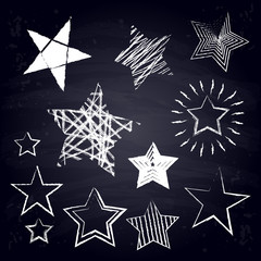 Chalk stars. Free hand drawn geometric figures. Chalkboard background.	
