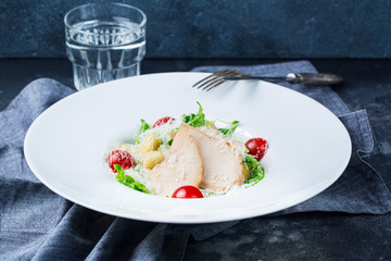 Caesar salad roast chicken fillet and vegetables water menu photo