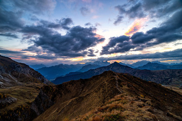 Beautiful sunset shot of majestic Dolomites mountains in Italian Alps. Landscape shot of high rocky mountains in the the Italian Dolomites during Autumn time.