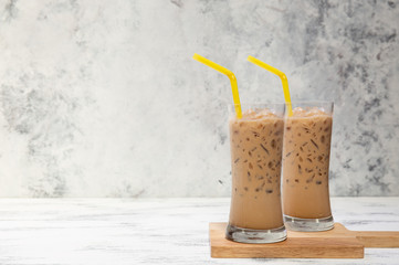fresh ice coffee cup on the white wooden