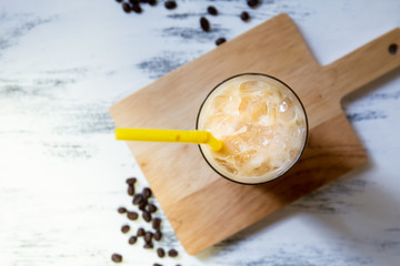 fresh ice coffee cup on the white wooden