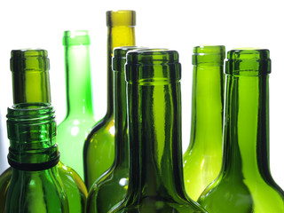Empty glass wine bottles on a white background