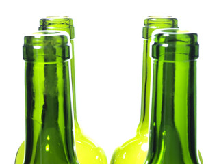 Empty glass wine bottles on a white background