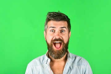 Cheerful man with long beard and mustache. Hipster in white shirt. Barber fashion and beauty. Fashionable bearded male. Smiling bearded man in casual clothes. Fashion model with stylish hair. Portrait