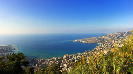 Fototapeta premium View of Jounieh bay with tiny paragliders flying about 