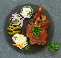 baked pork knuckle with pickles.