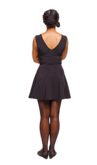 Back view of an African-American woman in a brown dress.