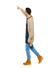 Side view of a man walking with a pointing hand.