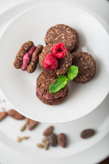 Very tasty vegan macaroons, strawberry macaron on white background almond macaroons, mint macaroons with almond nuts