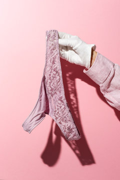 Hands with white gloves with panties