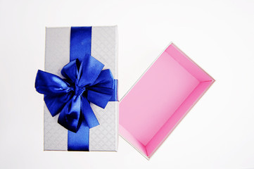 Open gift box with Blue ribbon on white background.