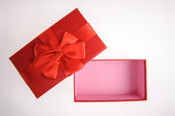 Open Gift box with Red ribbon bow isolated on white background