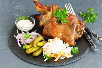 baked pork knuckle with pickles.