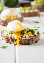 Breakfast with egg poached on avocado mashed 