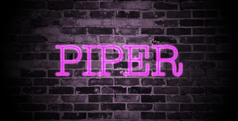 first name Piper in pink neon on brick wall