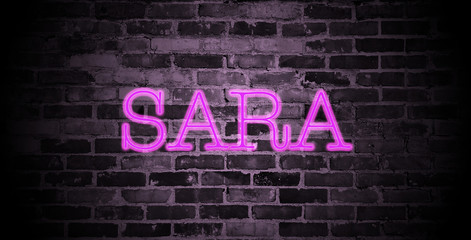 first name Sara in pink neon on brick wall - obrazy, fototapety, plakaty