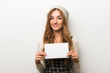 Fashionably woman wearing hat holding a placard for insert a concept