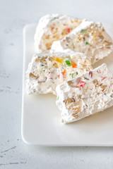 White nougat slices on white plate