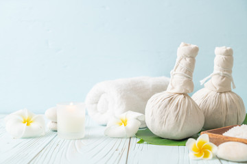 Fototapeta na wymiar Spa herbal compressing ball with candle and orchid