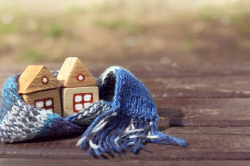 two wooden houses together in a blue warming scarf / full service discount