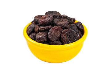 Dried Pitted Prunes Isolated on a white background. Selective focus.