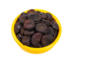 Dried Pitted Prunes Isolated on a white background. Selective focus.