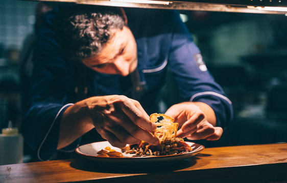 Chef cooking an exquisite plate of food.