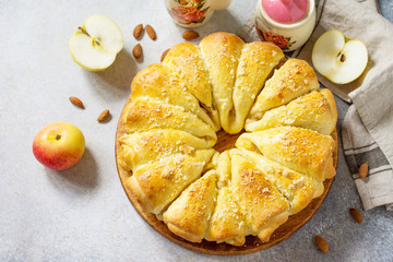 Fresh Homemade baking. Cake Buns with Apples and Almond on a light stone background. Top view flat lay background.