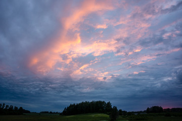 Fototapeta premium high contrast clouds on blue sky over natural landscape