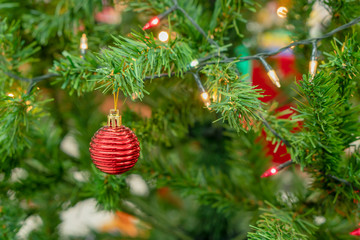 Decorate a Christmas tree on an abstract background.