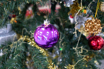 Decorate a Christmas tree on an abstract background.