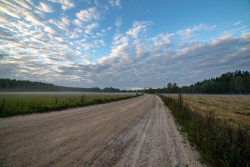 high contrast clouds on blue sky over natural landscape
