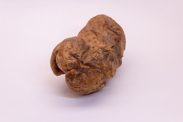 potato baked in the peel on a white background