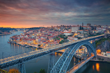 Fototapeta na wymiar Porto, Portugal. Aerial cityscape image of Porto, Portugal with the famous Luis I Bridge and the Douro River during dramatic sunset.