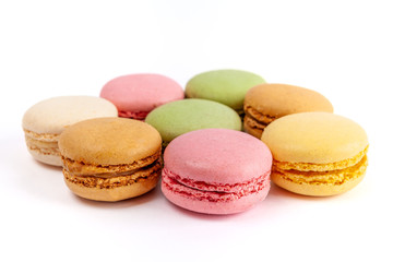 Yummy colorful macarons isolated on white background