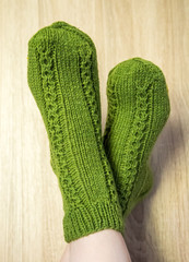 A woman wwearing colorful knitted wool socks.