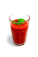 A glass of red organic smoothie drink, made of tomato, beetroot and basil isolated on a white background. Healthy diet concept.