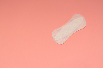 Sanitary pads for women, on pink background. Copy space.