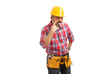 Constructor pulling eye as joke gesture.