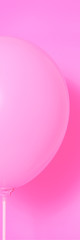 Fototapeta na wymiar Pink balloon on a pink background with a shadow.