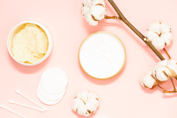 Beauty, depilation and hair removal concept on pink background with a sprig of cotton.