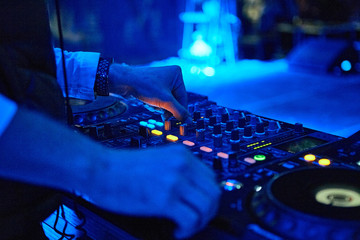 Dj hands mixing track outdoor at party festival nightlife view of disco club outside
