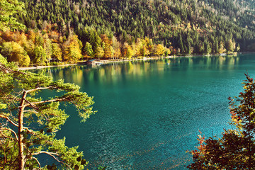 Beautiful blue mountain lake on a warm fall season day